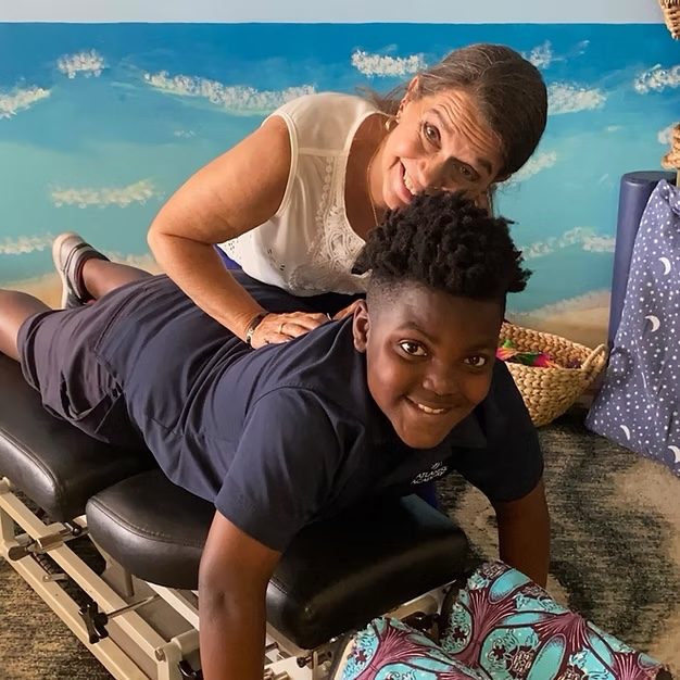 Dr. Karolyn Surmont caring for a pediatric chiropractic patient