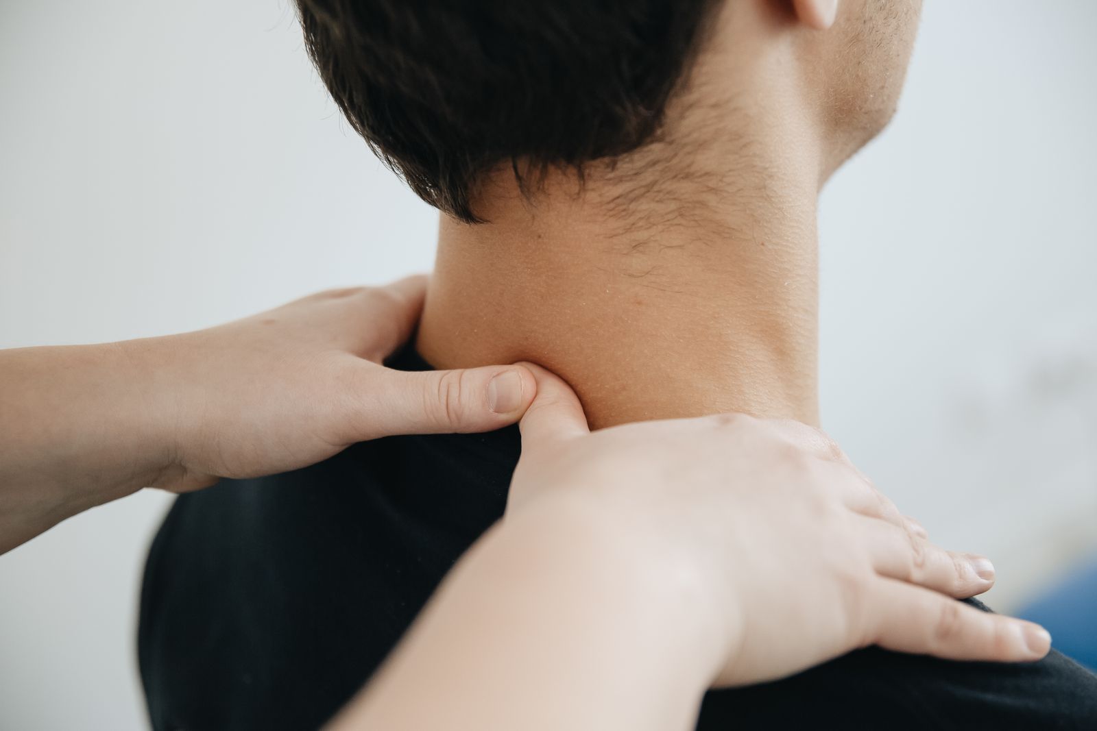 Therapist providing gentle neck care