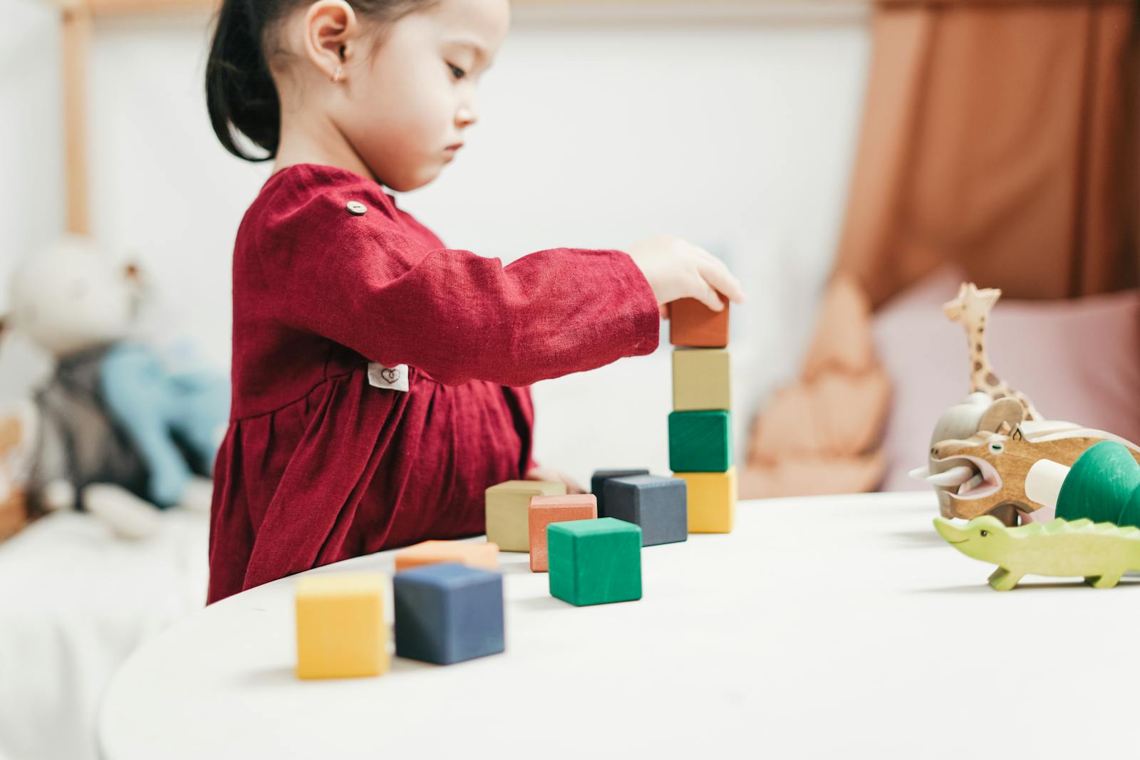 Child playing with developmental building blocks