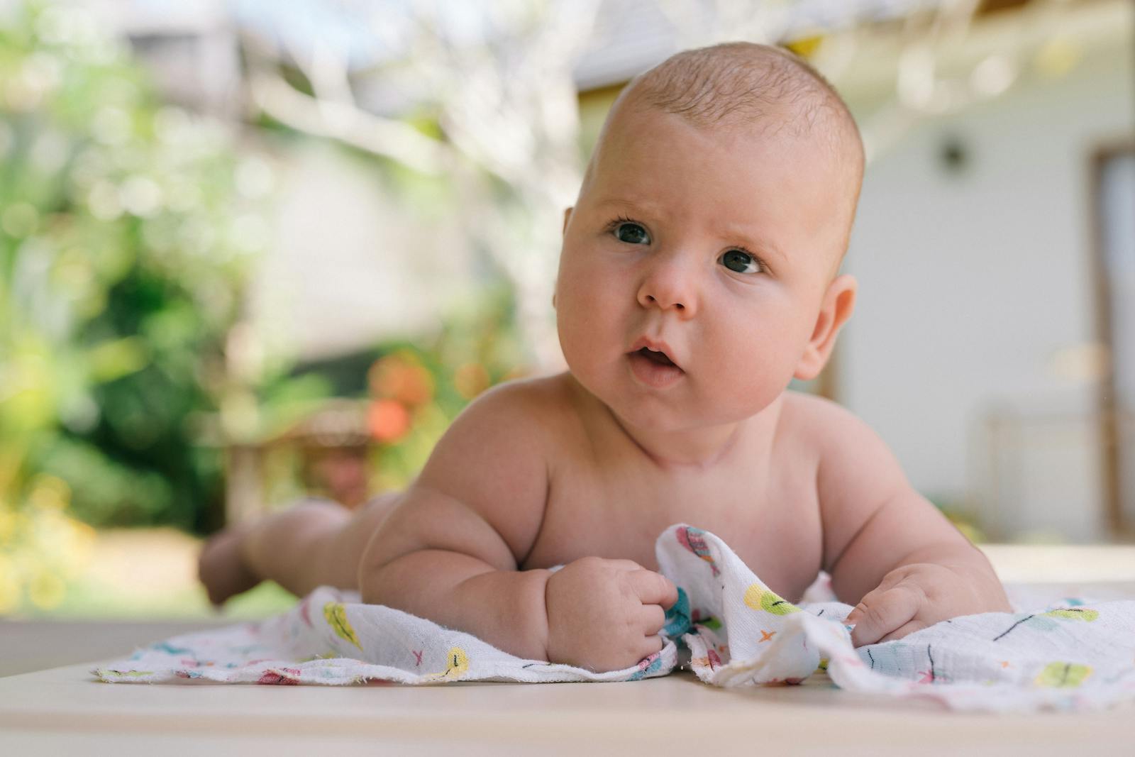 Baby lying with head turned to one side