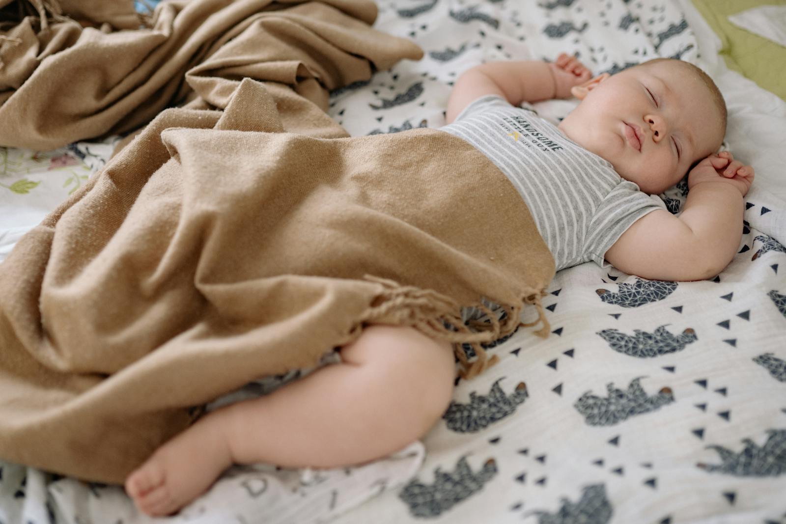 Parent soothing a baby to sleep