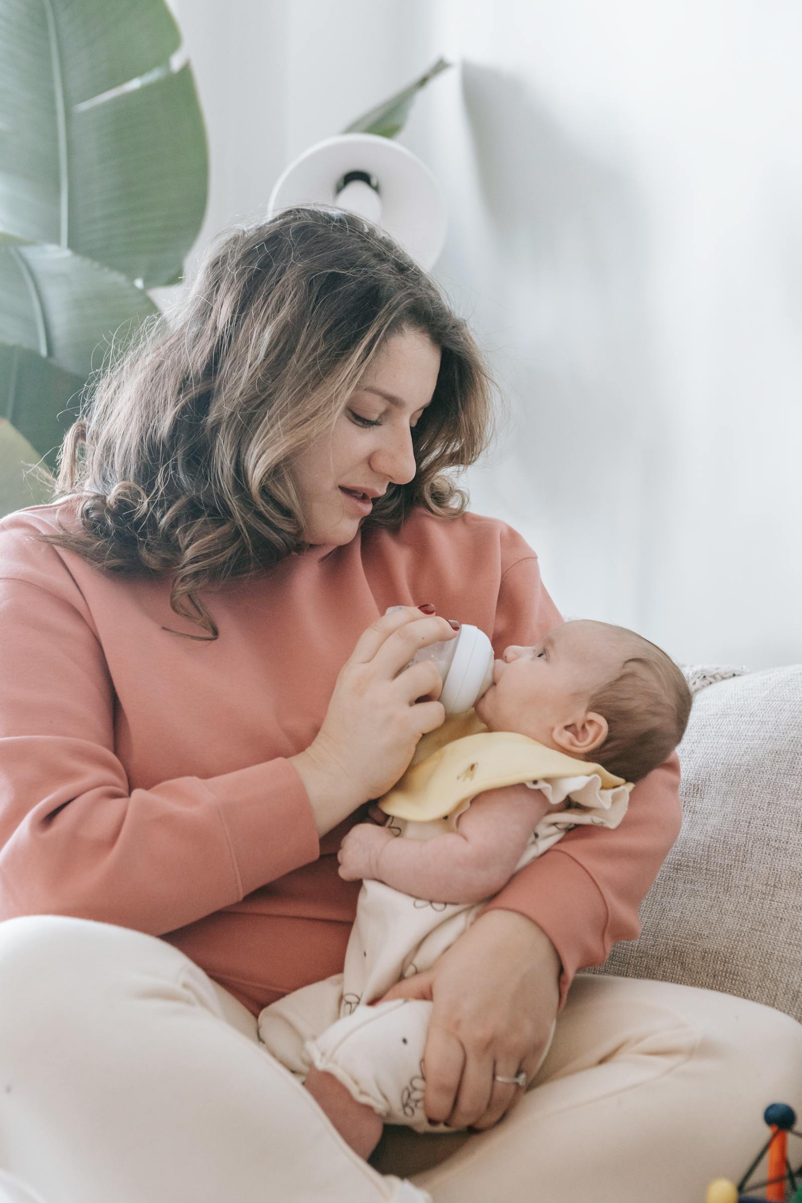 Parent caring for a baby after feeding