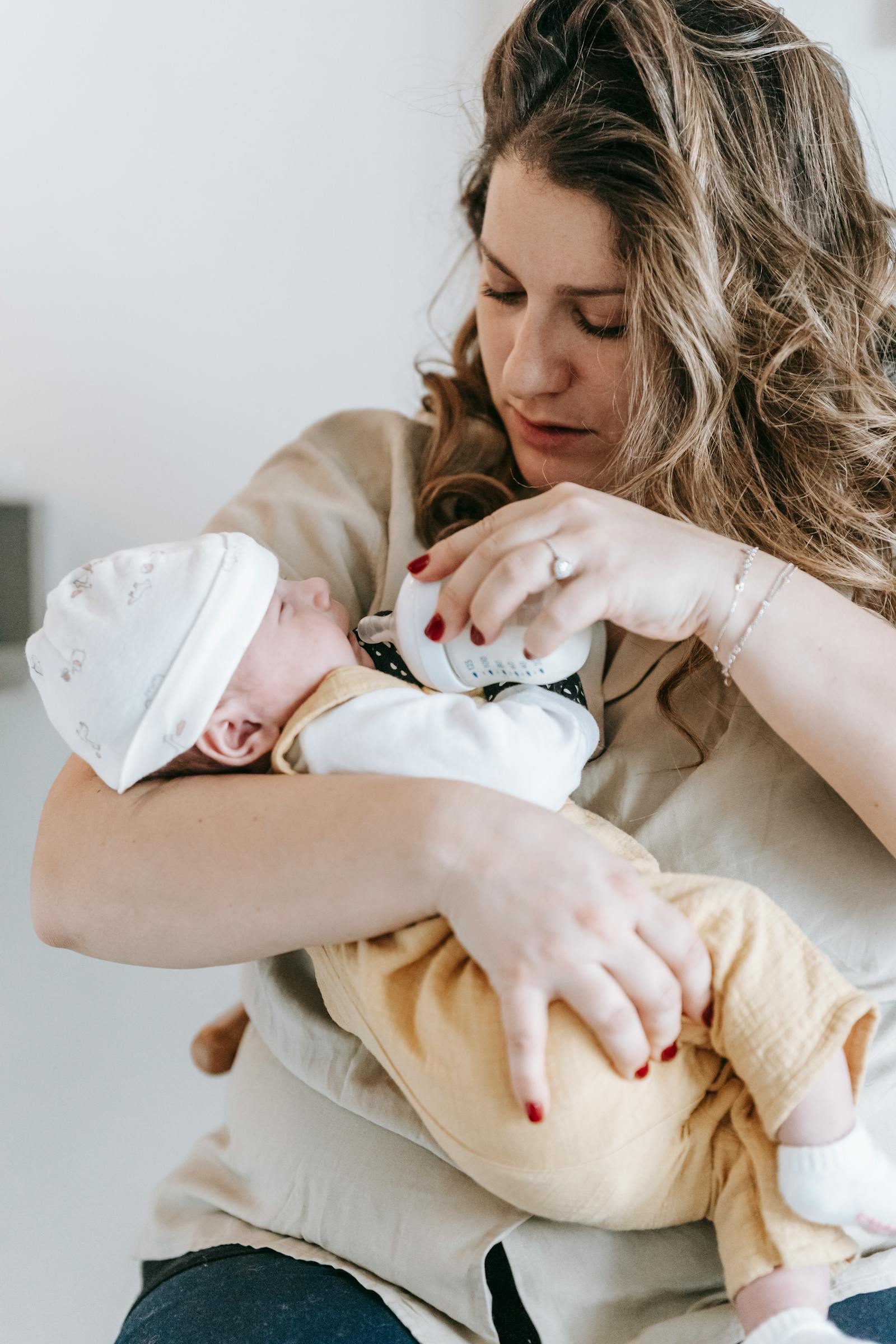 Parent feeding an infant