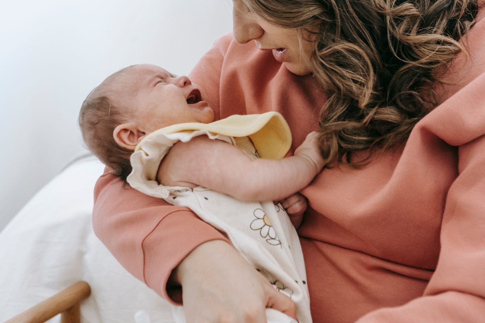 Parent soothing a fussy baby